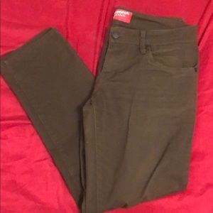 Green colored skinny jeans.